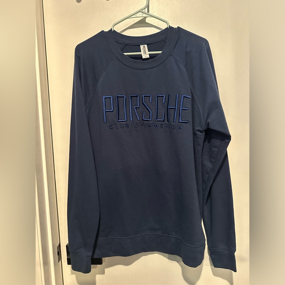 Large Men’s oversized sweater that has Porsche Club of America written on it.